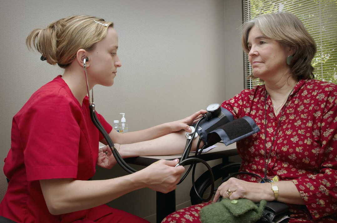 doctor examining patient
